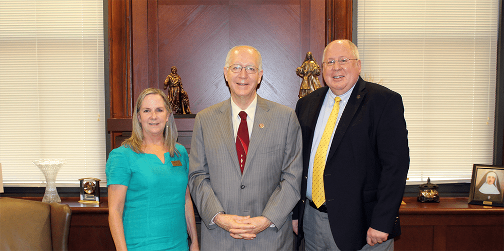 Congressman Bill Foster presents a $500,000 grant to USF College of Business & Health Administration Dean Dr. Shannon Brown and USF President Dr. Arvid C. Johnson.