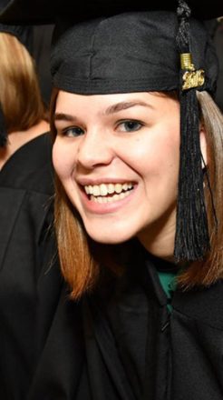 college graduate smiling